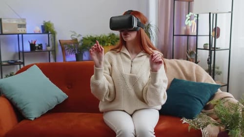 Woman Enjoys Virtual Reality Headset on Couch