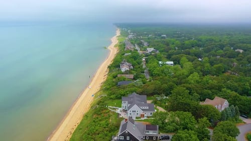 Aerial View of Beachfront Homes and Sandy Coastline