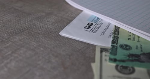 Tax Refund Check with US Currency and Form