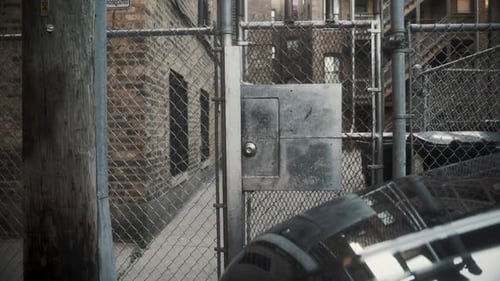 Slow dolly towards Chicago gangway fence