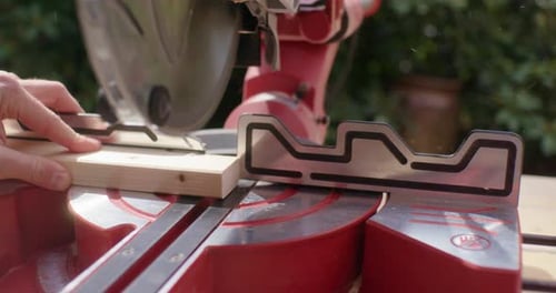 Close up of sawing a thin piece of wood