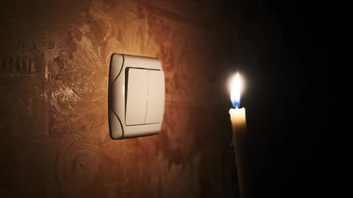 Blackout Burning Candle in a Dark Room Near Light Switch on Wall Turn On Off