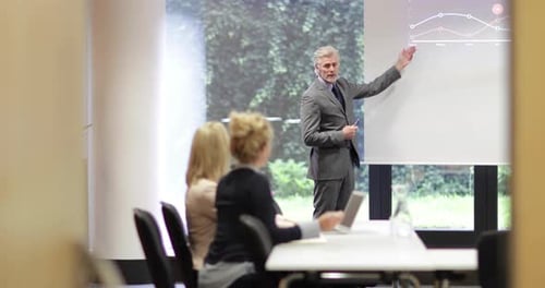 Professional Man Presenting Business Data in Meeting