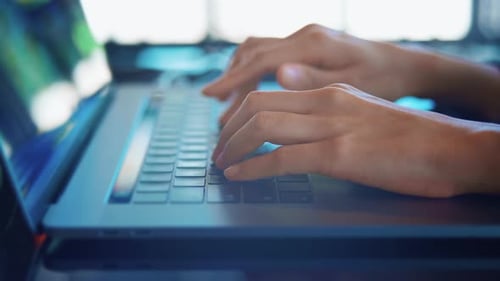 Close up business woman hand is typing on laptop Keyboard in office