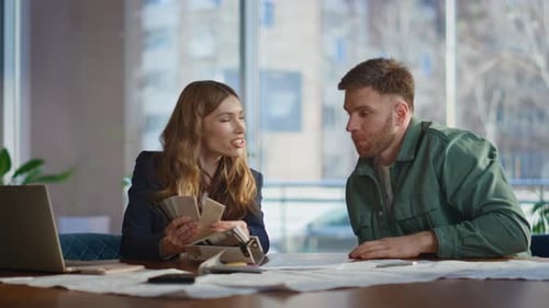 Creative Manager Discussing Samples Decor with Man Client in Agency Office