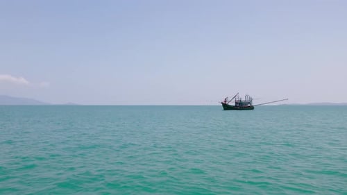 Fly towards local style fishing boat in Thailand