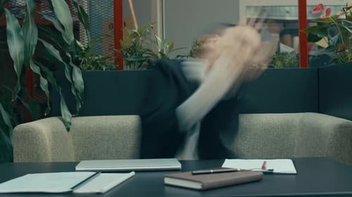 Motion Blur Shot of Office Employee Dancing at Workplace