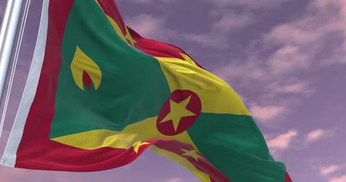 Grenada Flag Waving Against Cloudy Sky