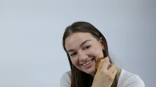 Woman Applying Make-up With a Cosmetic Brush