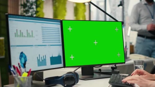 Executive Assistant Analyzing KPI Metrics on Computer Monitor with Mockup