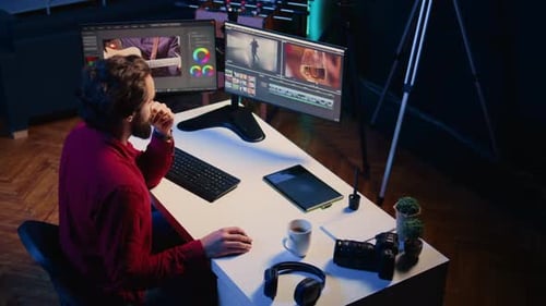 Video Editor Polishing Raw Footage Applying Modern Editing Techniques