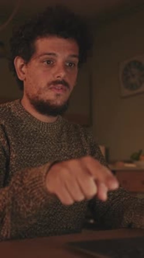 Man Talking On a Video Call at Night