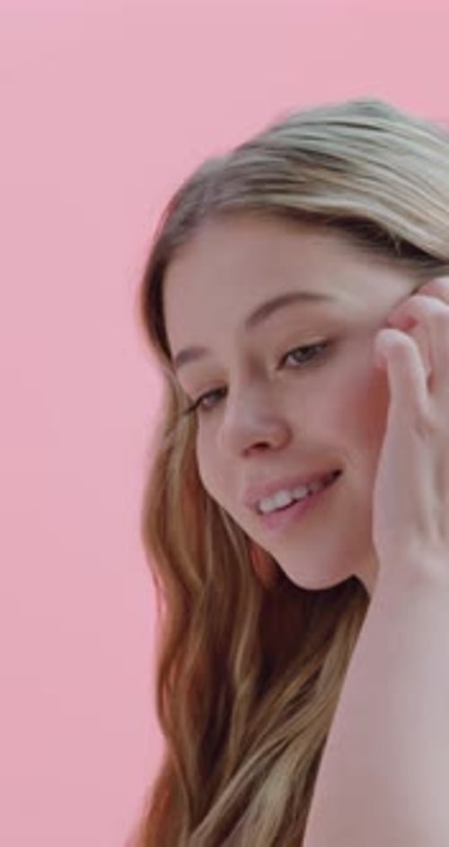 Girl, face and smile with hair care in studio, results and growth with confidence on pink