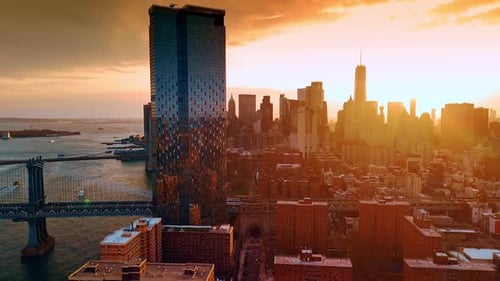 Orange light covering the scenery of New York. Skyscrapers skyline at backdrop.