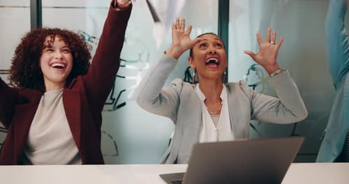 Happy Colleagues Celebrating Business Success in Office