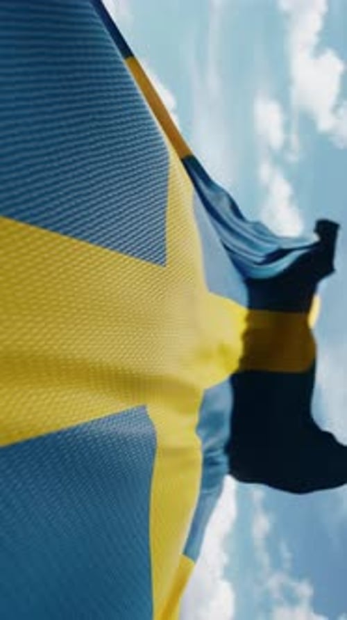 Sweden Flag Waving in Wind with Blue Sky Background