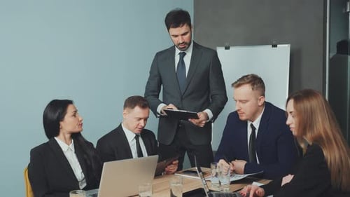 Enthusiastic Business Meeting in Modern Office Space