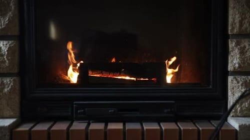 Heating, Warmth, Fire and Cosiness Concept - Close Up of Burning Fireplace