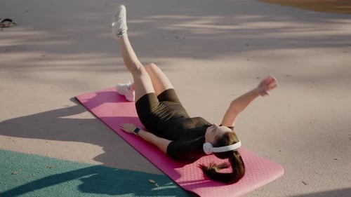 Woman Doing Leg Lifts Outside
