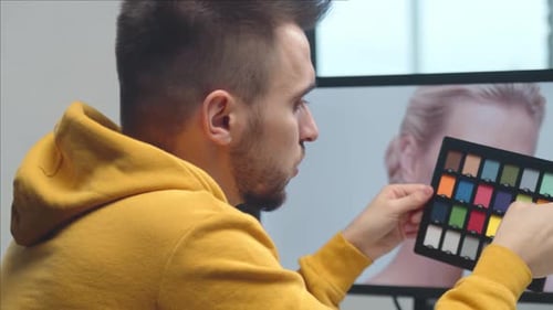 Freelance Videographer Colorist Editing Footage Using Professional Software Monitor and Montage