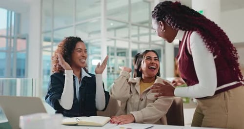 Laptop, university and women high five for success, learning goal or education target