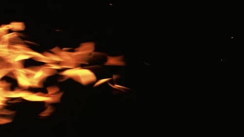 Vertikale Feuerhintergrundflamme auf schwarzen Funken