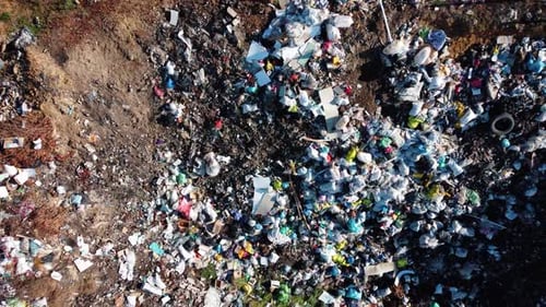 Aerial Drone View of Large Garbage Landfill Trash Dump Waste From Household Dumping Site Excavator