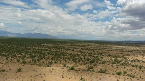 Wide drone shot of the Sonoran desert in Arizona, slow moving aerial shot