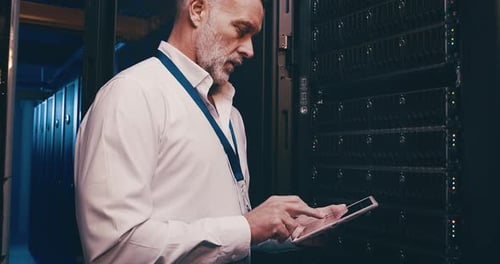 Mature man in data center with tablet, network maintenance and engineer in digital storage