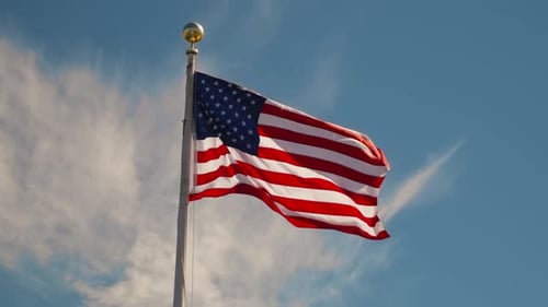 American Flag Waving Against a Blue Sky