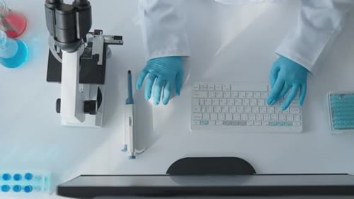 Scientist Analyzing Samples with Microscope in Laboratory Setting