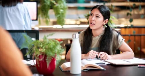 Student, woman and discussion in college with study group, education or knowledge for homework task