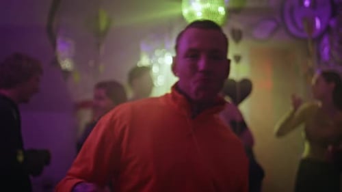 Cheerful Man Dancing Disco Ball at Festive Party Closeup Smiling Guy Nightclub