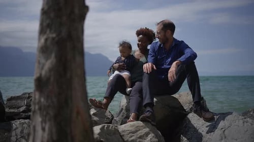 A Loving Family Enjoying a Wonderful Day Together By the Beautiful Lake on a Sunny Afternoon