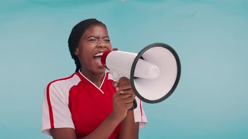 Sports, cheers and black woman in studio with megaphone, motivation or winning announcement