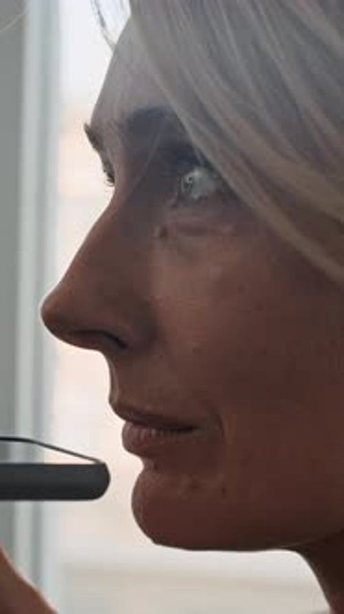 Smiling Woman Recording Voice Message
