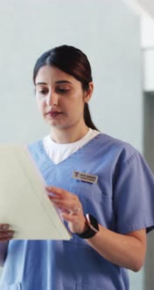 Woman, doctor and reading with folder at hospital for medical file, patient history