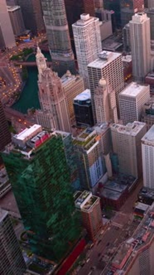 Modern beautiful high buildings of Chicago downtown. Vibrant city lighting lights in the evening