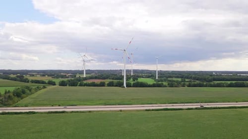 Wind turbines next to highway