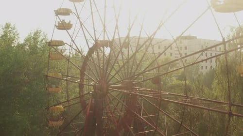 Flying at abandoned Pripyat ghost town at Chernobyl exclusion zone. The Ferris wheel visible. Climbi