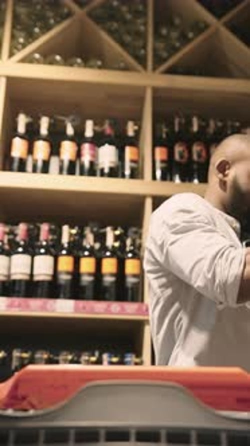 The Role of a Professional Media Stocker Involves Organizing a Captivating Wine Display