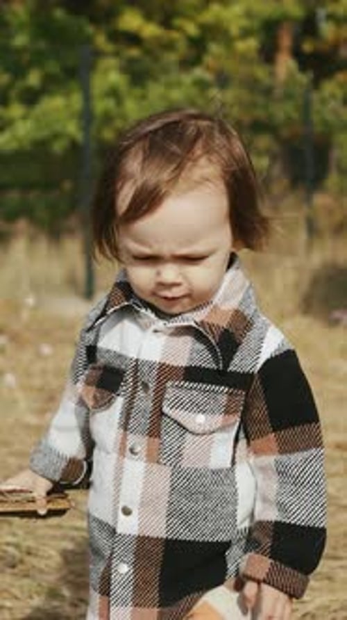 Adorable Toddler Walks in Nature Wearing Plaid Shirt