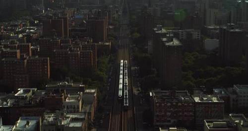 New York City skyscrapers buildings and trains seen from above on a sunny day