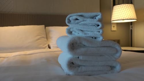 white towel shower on bed decoration in hotel