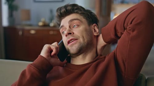 Man Talking on Cell Phone Indoors