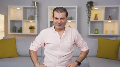 Man looking depressed at camera.