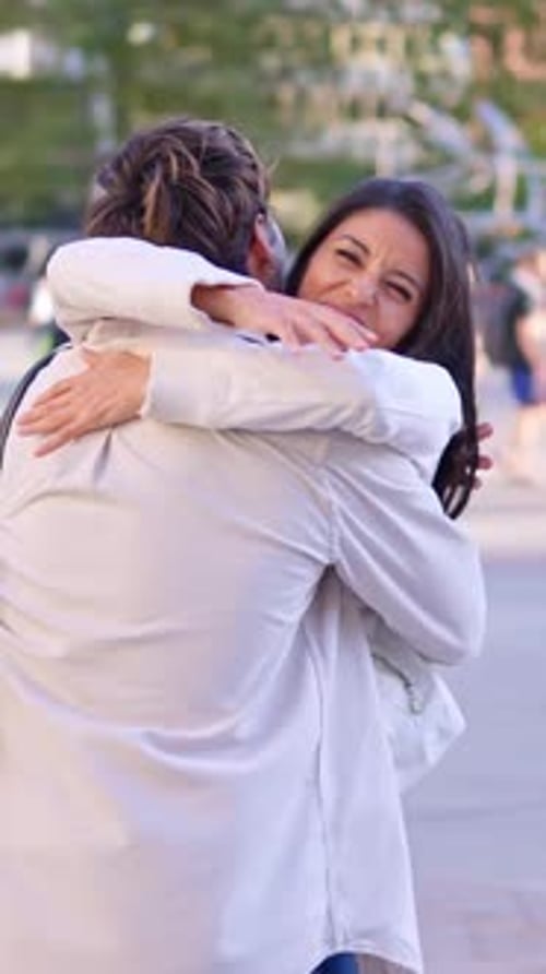 Joyful Reunion Between Two Friends Hugging