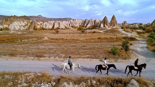 Horseback Riding in a Desert Landscape