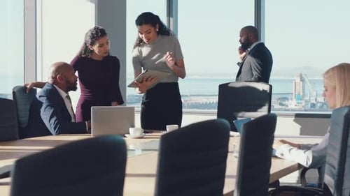Corporate Team Meeting in Modern Office with Skyline View