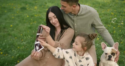 Loving Family Shares Anticipation of New Baby Outdoors